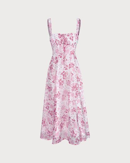 De roze midijurk met vierkante hals, bloemenprint en ruches